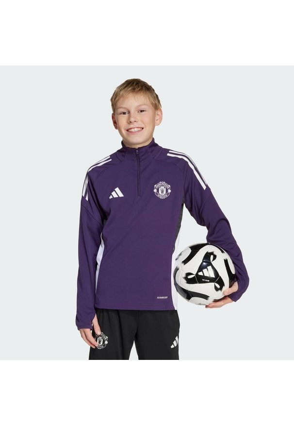 Adidas - Bluza Manchester United Tiro 25 Competition Training Kids. Kolor: wielokolorowy, fioletowy, biały, czarny. Materiał: dresówka. Sport: piłka nożna