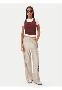 Adidas - adidas Spodnie dresowe Metallic Firebird KS9974 Beżowy Wide Leg. Kolor: beżowy. Materiał: syntetyk #2