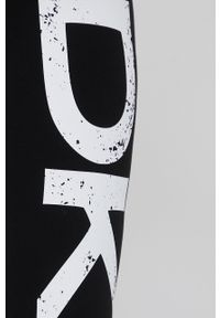 DKNY - Dkny legginsy damskie kolor czarny z nadrukiem. Kolor: czarny. Materiał: dzianina. Wzór: nadruk