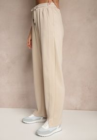 Renee - Beżowe Szerokie Spodnie Dresowe High Waist Ozdobione Sznurkiem Haliran. Okazja: na co dzień, na spacer. Stan: podwyższony. Kolor: beżowy. Materiał: dresówka. Wzór: aplikacja. Styl: elegancki, casual #3