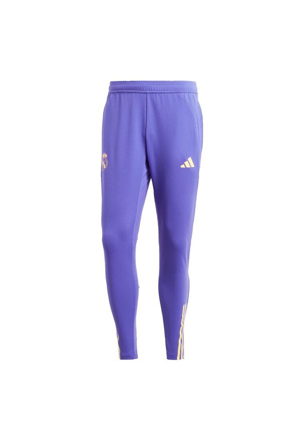 Adidas - Spodnie Real Madrid Tiro 23 Training. Kolor: fioletowy. Materiał: materiał. Sport: piłka nożna