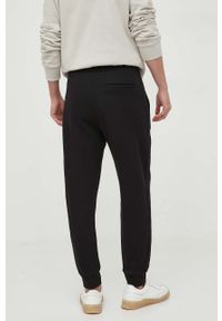 Armani Exchange spodnie dresowe bawełniane kolor czarny gładkie. Kolor: czarny. Materiał: bawełna, dresówka. Wzór: gładki #2