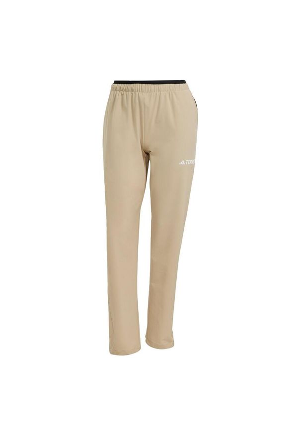 Adidas - Spodnie Terrex Multi Liteflex. Kolor: beżowy. Materiał: materiał