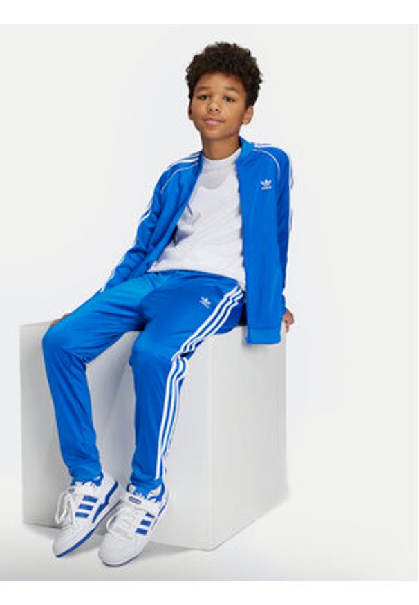 Adidas - adidas Spodnie dresowe adicolor SST IY4007 Niebieski Regular Fit. Kolor: niebieski. Materiał: syntetyk