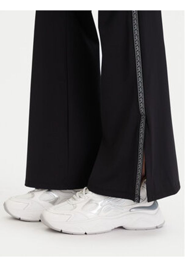 MICHAEL Michael Kors Legginsy MF530W51RE Czarny Flare Fit. Kolor: czarny. Materiał: syntetyk
