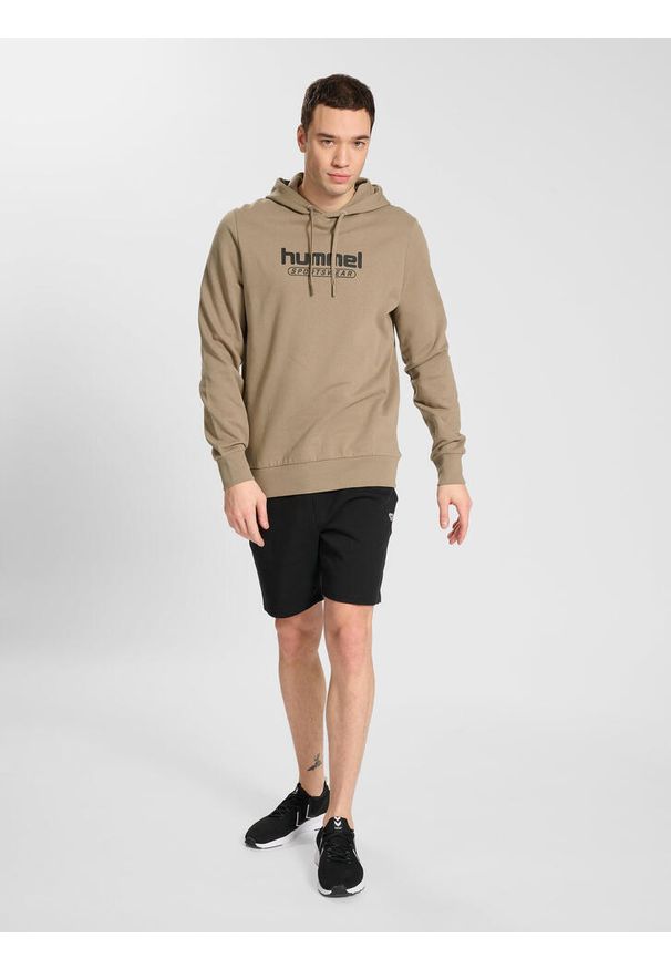 Sweat z kapturem Hummel Booster. Typ kołnierza: kaptur. Kolor: wielokolorowy, beżowy, brązowy. Sport: fitness