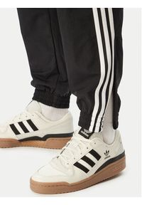 Adidas - adidas Spodnie dresowe Firebird Woven KE1371 Czarny Regular Fit. Kolor: czarny. Materiał: syntetyk #5