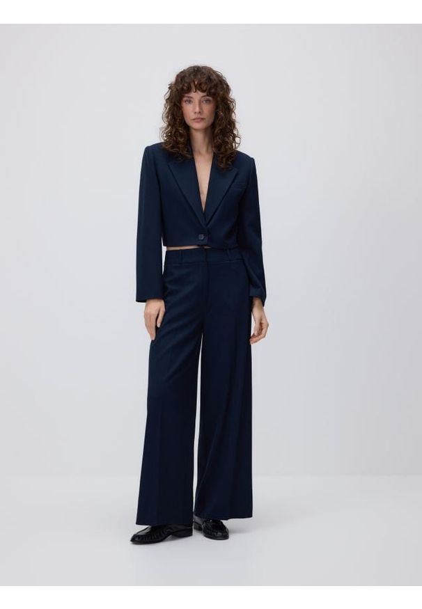 Reserved - Spodnie z wiskozą - granatowy. Kolor: niebieski. Materiał: wiskoza