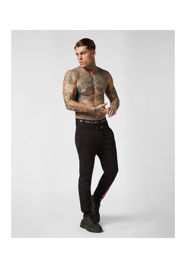 Philipp Plein - PHILIPP PLEIN Spodnie dresowe męskie ,,joggging trousers rock pp. Kolor: czarny. Materiał: dresówka. Wzór: napisy