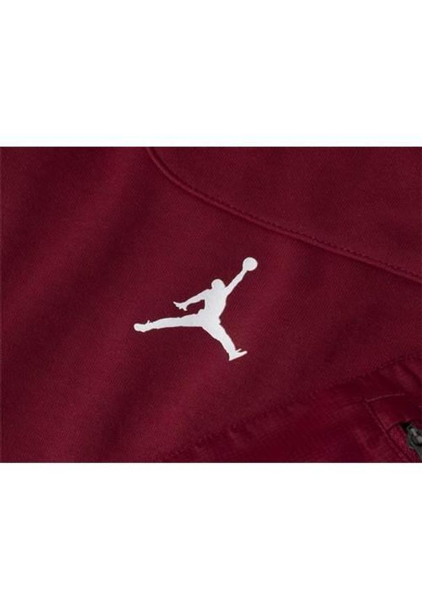 Spodnie sportowe męskie Nike Jordan. Kolor: czerwony. Materiał: bawełna, materiał, syntetyk