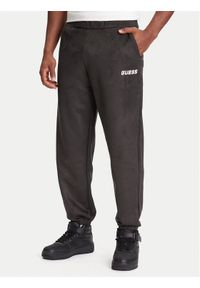 Guess Spodnie dresowe Z5YB03 KCJY2 Zielony Regular Fit. Kolor: zielony. Materiał: bawełna #1