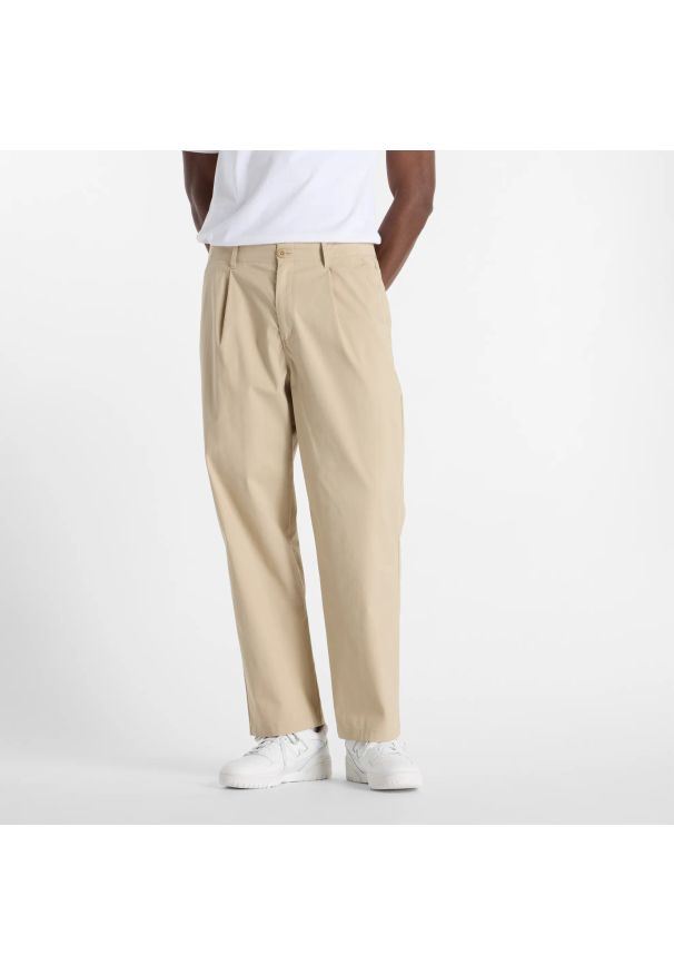 Spodnie męskie New Balance MP51563SOT – beżowe. Kolor: beżowy. Materiał: bawełna, materiał, nylon