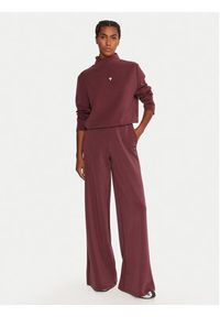 Guess Spodnie dresowe V4YB07 KCAY2 Bordowy Relaxed Fit. Kolor: czerwony. Materiał: syntetyk