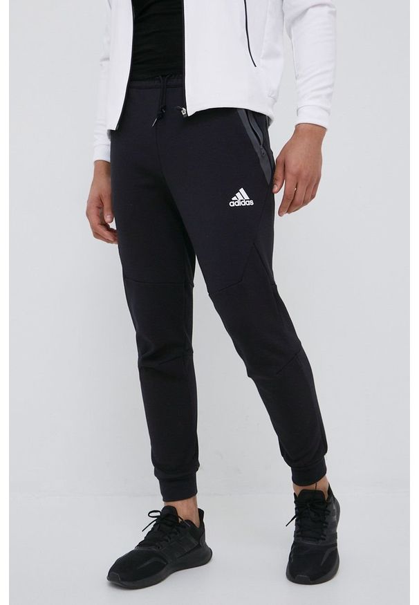 adidas Performance spodnie dresowe HE5038 męskie kolor czarny gładkie. Kolor: czarny. Materiał: dresówka. Wzór: gładki