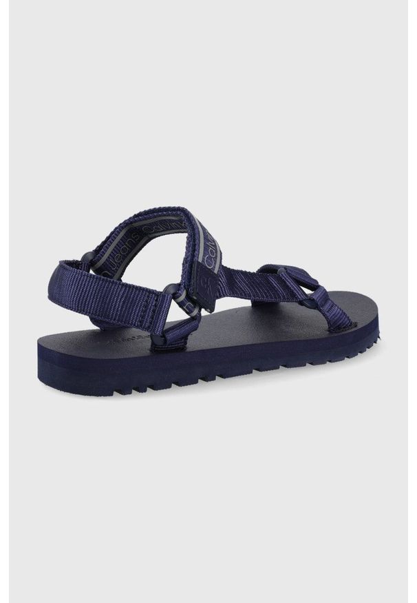 Calvin Klein Jeans sandały męskie kolor granatowy. Zapięcie: rzepy. Kolor: niebieski. Materiał: materiał. Wzór: gładki. Obcas: na obcasie. Wysokość obcasa: niski