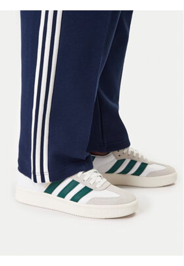 Adidas - adidas Spodnie dresowe adicolor Spacer Track KD4087 Granatowy Baggy Fit. Kolor: niebieski. Materiał: bawełna. Sport: turystyka piesza