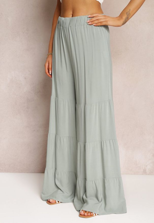 Renee - Miętowe Gładkie Spodnie z Szerokimi Nogawkami i Gumką w Talii Myrieniela. Okazja: na co dzień. Kolor: miętowy. Materiał: tkanina. Wzór: gładki. Styl: casual