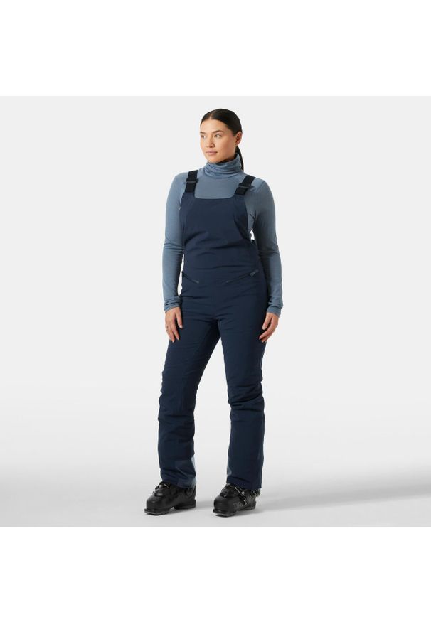 Damski kombinezon narciarski Helly Hansen Alphelia. Kolor: niebieski. Sezon: zima. Sport: narciarstwo