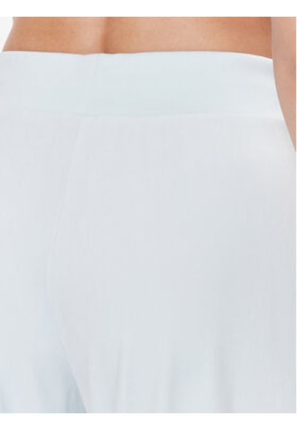 Guess Spodnie dresowe V3BB27 KBXI2 Niebieski Regular Fit. Kolor: niebieski. Materiał: syntetyk