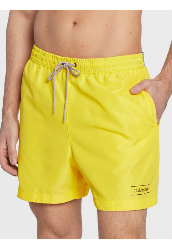 Calvin Klein Swimwear Szorty kąpielowe KM0KM00787 Żółty Regular Fit. Kolor: żółty. Materiał: syntetyk