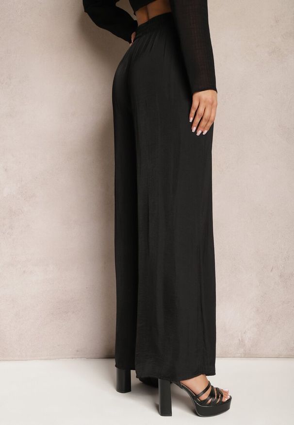 Renee - Czarne Letnie Spodnie o Szerokim Fasonie z Gumką w Talii Philomen. Kolor: czarny. Sezon: lato