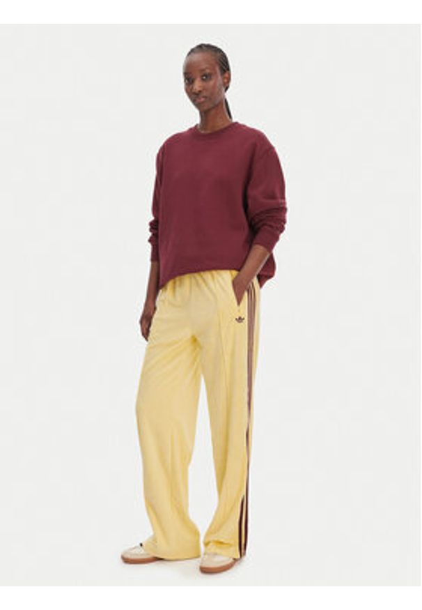 Adidas - adidas Spodnie dresowe Terry Towel Firebird KQ6662 Żółty Loose Fit. Kolor: żółty. Materiał: bawełna