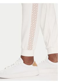 BOSS Spodnie dresowe Monogram 50535841 Écru Regular Fit. Materiał: syntetyk