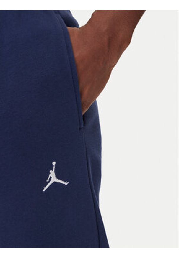 Nike Spodnie dresowe FV7277 410 Granatowy Regular Fit. Kolor: niebieski. Materiał: bawełna