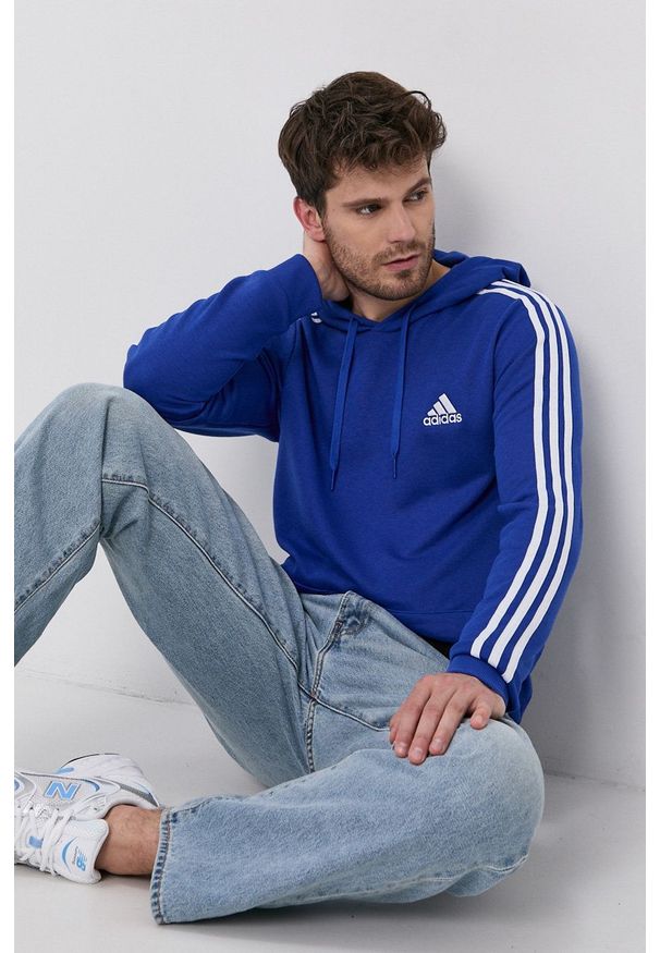 Adidas - adidas Bluza męska z kapturem gładka. Typ kołnierza: kaptur. Kolor: niebieski. Wzór: gładki