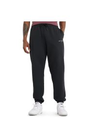 Spodnie New Balance MP51505BK - czarne. Kolor: czarny. Materiał: dresówka, bawełna, materiał, poliester. Wzór: napisy
