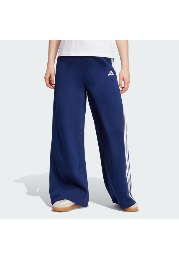 Adidas - Spodnie adidas 3-Stripes Fleece Wide. Kolor: niebieski