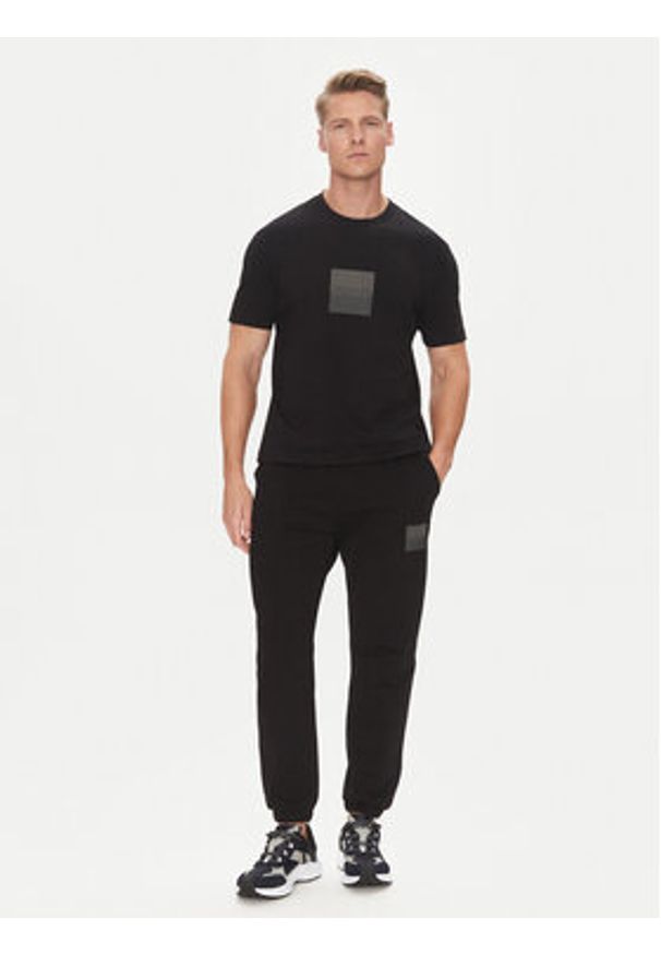 Hugo - HUGO Spodnie dresowe Dusplitan 50542866 Czarny Relaxed Fit. Kolor: czarny. Materiał: bawełna