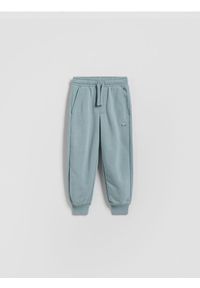 Reserved - Bawełniane spodnie jogger - jasnoniebieski. Kolor: niebieski. Materiał: bawełna