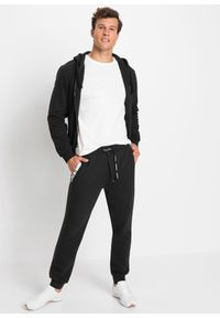 bonprix - Spodnie sportowe z modnymi szczegółami. Kolor: czarny. Styl: sportowy #2