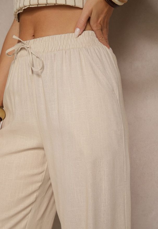 Renee - Jasnobeżowe Spodnie z Lnem o Szerokim Kroju z Gumką w Talii Filarive. Okazja: na co dzień. Kolor: beżowy. Materiał: len. Sezon: wiosna, lato. Styl: casual, elegancki