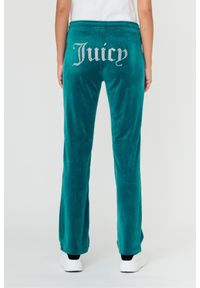 Juicy Couture - JUICY COUTURE Turkusowe spodnie Tina. Kolor: niebieski. Materiał: poliester. Wzór: aplikacja