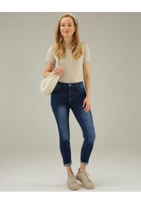 Unisono - SPODNIE - JEANSY Z PRZETARCIAMI. Materiał: jeans. Długość: długie. Styl: klasyczny #3