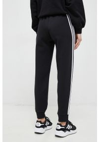 Adidas - adidas spodnie dresowe kolor czarny z aplikacją. Kolor: czarny. Materiał: dresówka. Wzór: aplikacja #4