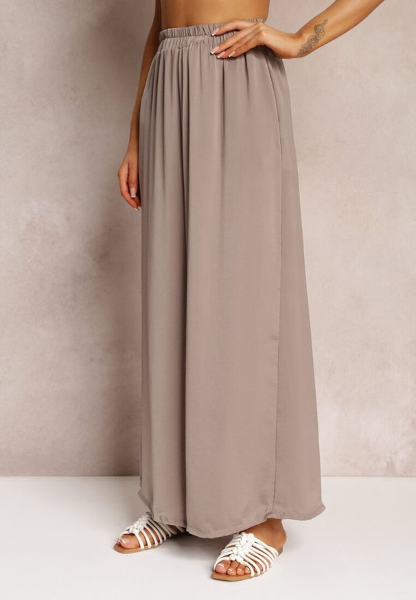 Renee - Ciemnobeżowe Spodnie z Szerokimi Nogawkami i Gumką w Pasie Jacobisa. Stan: podwyższony. Kolor: beżowy