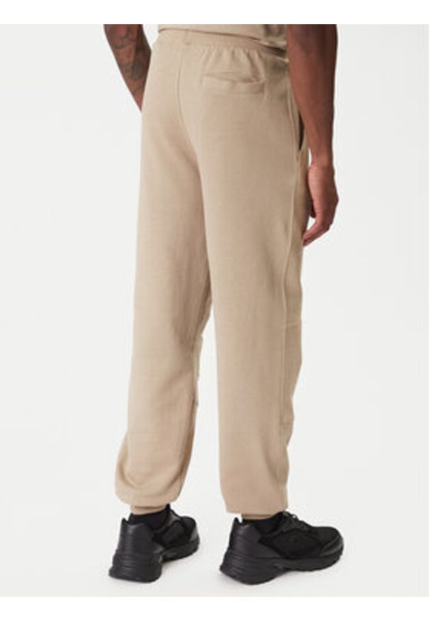 Guess Spodnie dresowe Z6RB03 K9YI1 Beżowy Regular Fit. Kolor: beżowy. Materiał: bawełna