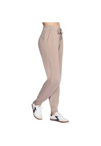 skechers - Spodnie sportowe damskie Skechluxe Elevate Jogger Pant. Kolor: beżowy. Materiał: poliester. Długość: długie