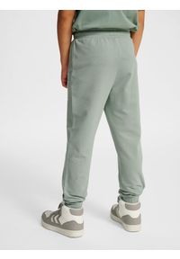 Spodnie dresowe dla dzieci Hummel Tukas. Kolor: zielony. Materiał: dresówka. Sport: joga i pilates, bieganie