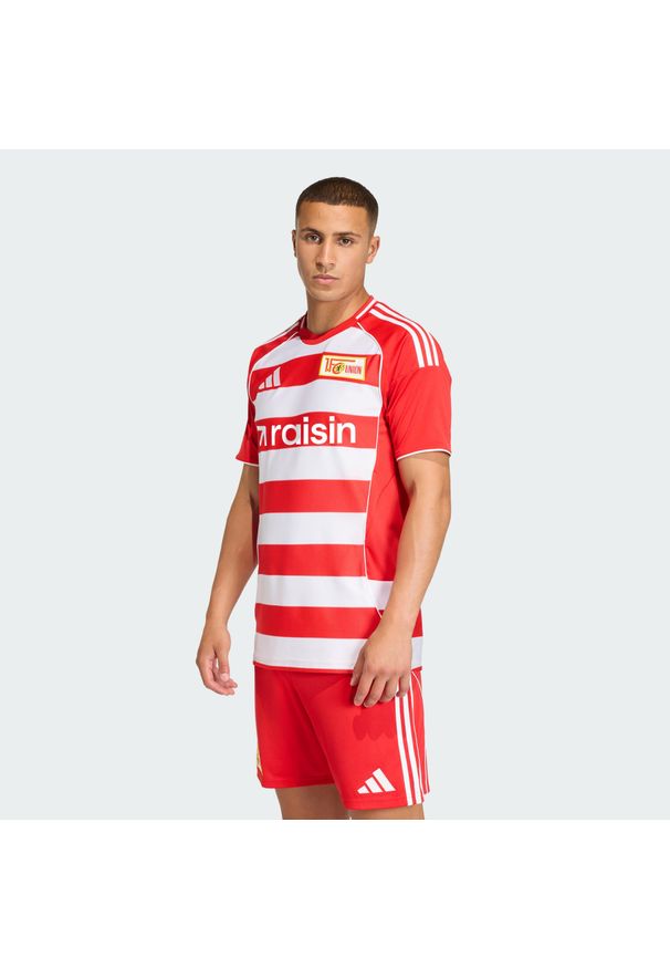 Adidas - Koszulka 1. FC Union Berlin 25/26 Home. Kolor: wielokolorowy, czerwony, biały, różowy. Sport: piłka nożna