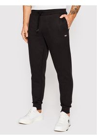 Tommy Jeans Spodnie dresowe DM0DM15380 Czarny Slim Fit. Kolor: czarny. Materiał: syntetyk