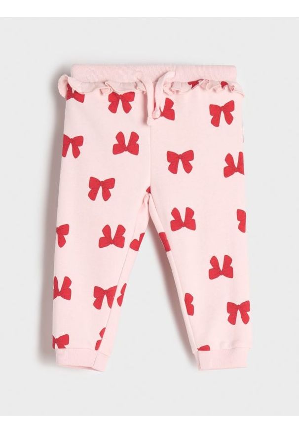 Sinsay - Spodnie dresowe z falbanką - begonia. Materiał: dresówka. Długość: długie