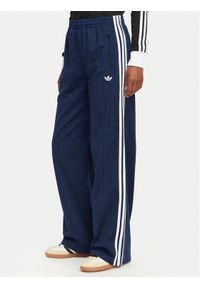 Adidas - adidas Spodnie dresowe Pinstripe Firebird Loose Trackpant KS9976 Granatowy Loose Fit. Kolor: niebieski. Materiał: syntetyk #1