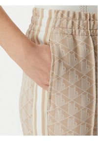 Lacoste Spodnie dresowe XF9313 Beżowy jasny Regular Fit. Kolor: beżowy. Materiał: syntetyk #5