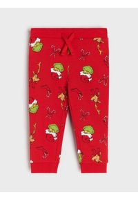Sinsay - Spodnie jogger ze wzorem Grinch - czerwony. Kolor: czerwony