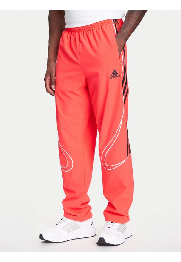 Adidas - adidas Spodnie dresowe Teamgeist adicolor JW5871 Czerwony Loose Fit. Kolor: czerwony. Materiał: syntetyk
