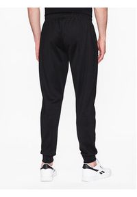 Ellesse Spodnie dresowe Bertoni SHR04351 Czarny Regular Fit. Kolor: czarny. Materiał: syntetyk, bawełna